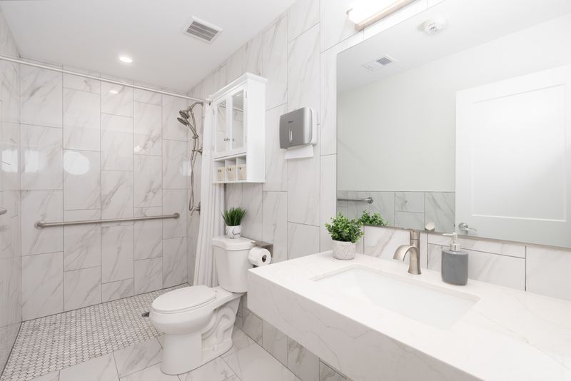 Marble bathroom with a walk-in shower and a soaking tub